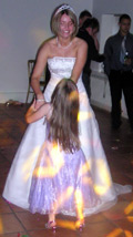 Bride dancing with young guest